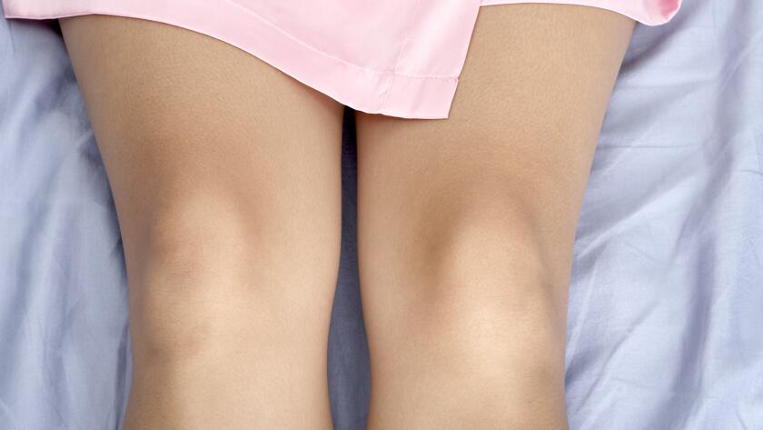close-up-of-womans-knees