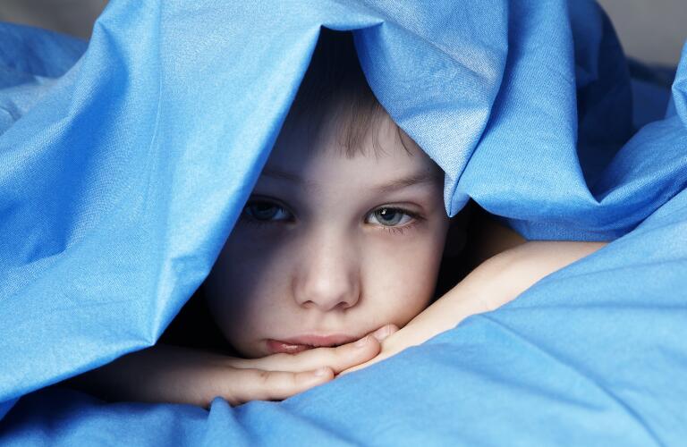 child under covers