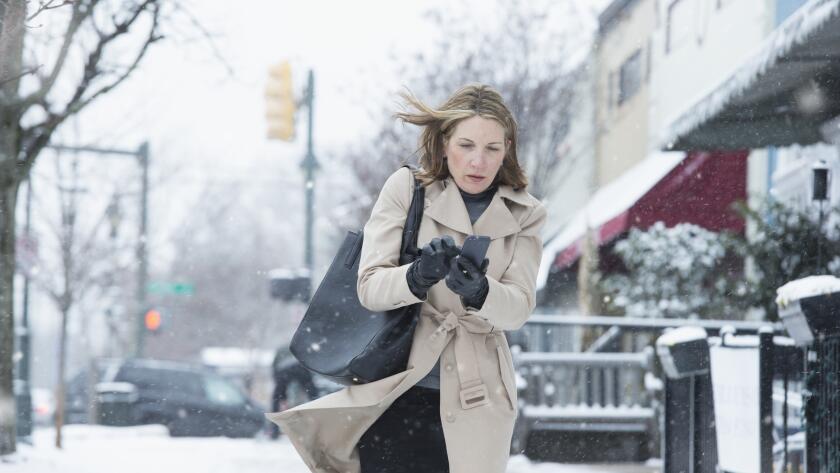 woman-walking-in-snowy-weather