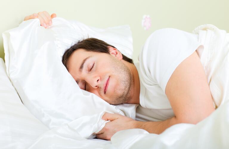 Man sleeping in bed