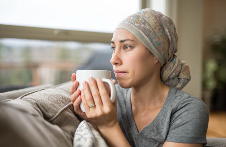 Cancer patient staring out of window