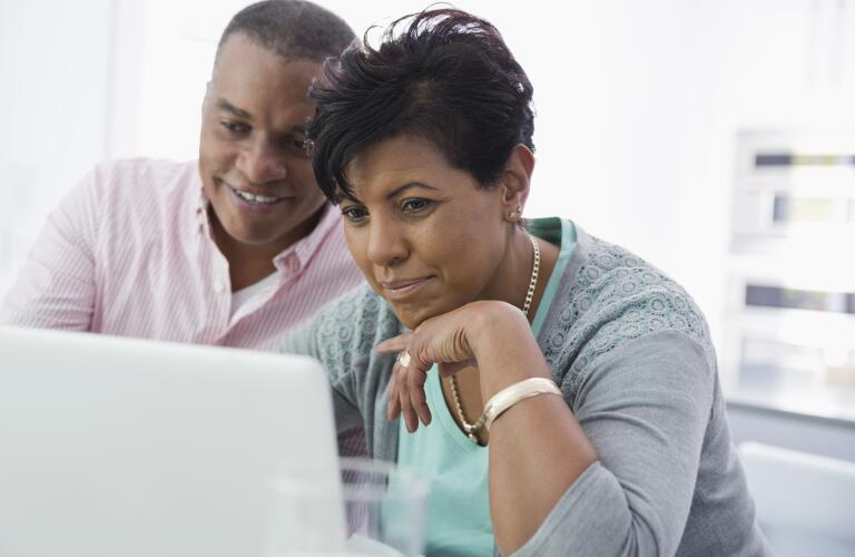 Couple using laptop