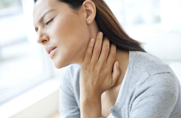 woman-touching-throat