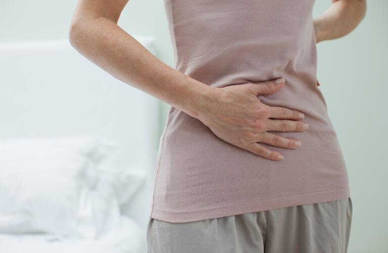 woman-rubbing-aching-stomach