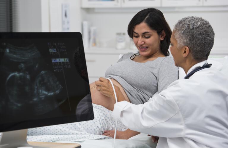 Doctor, patient during sonogram