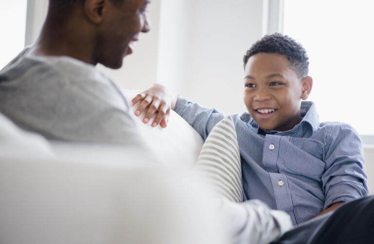 father-son-talking-on-couch