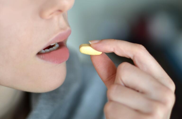 Woman-taking-a-pill